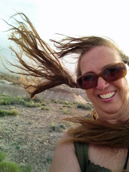 Karen Duquette caught in the wind on Blue Mesa Overlook